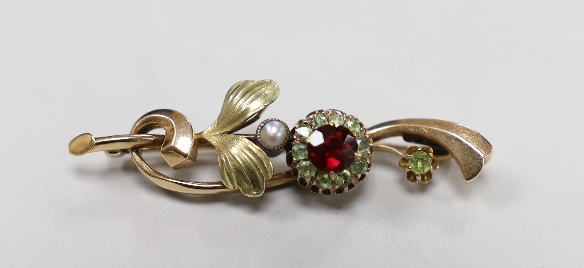An early to mid 20th century Russian 56 zolotnik yellow metal, garnet? and split pearl set foliate brooch, 48mm, gross 4.3 grams.